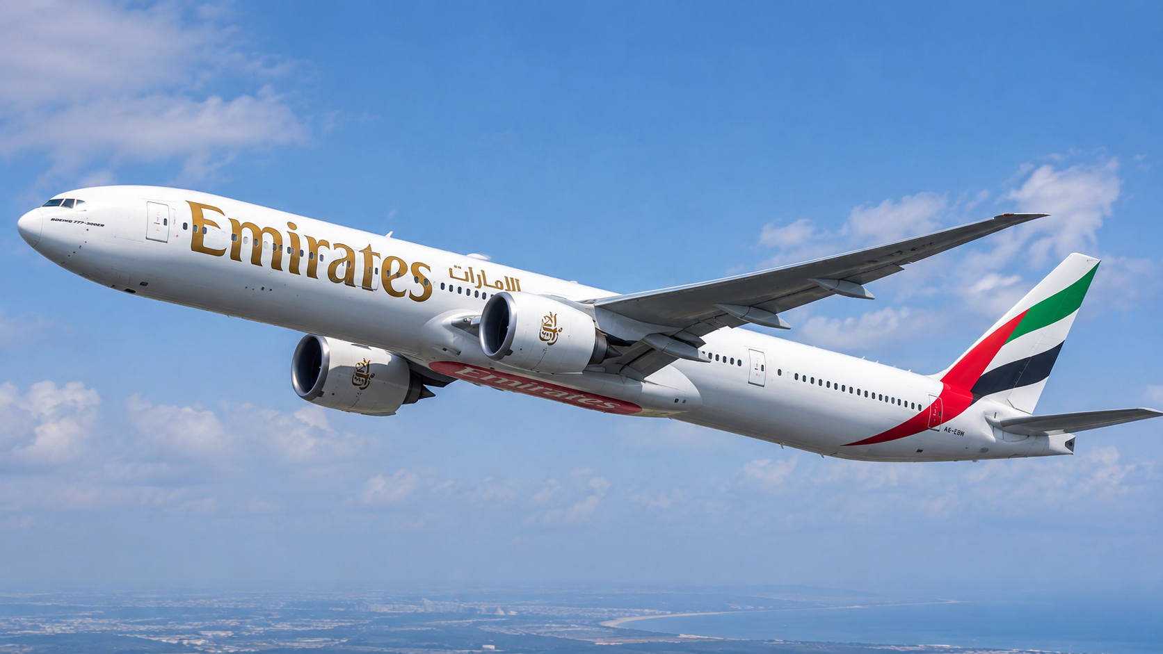 Emirates Boeing 777-300ER climbing after takeoff against a blue sky