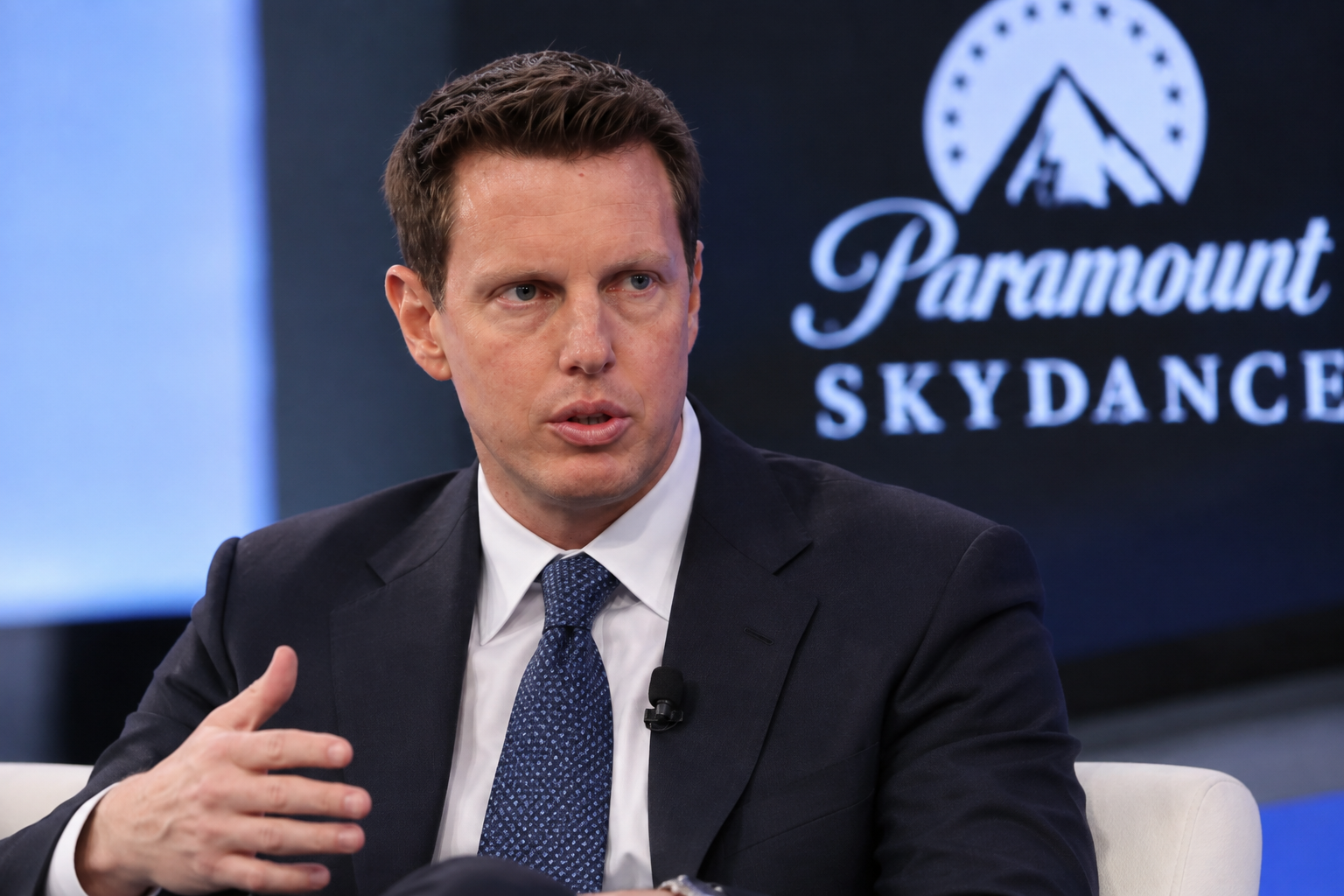 David Ellison, chairman and CEO of Paramount Skydance, speaking on stage in front of a Paramount Skydance event backdrop